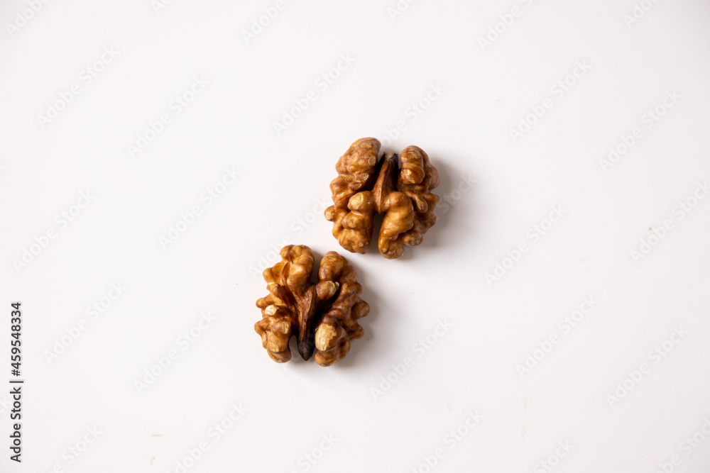 walnut peeled kernel on a white background two halves walnut peeled kernel on a white background two halves