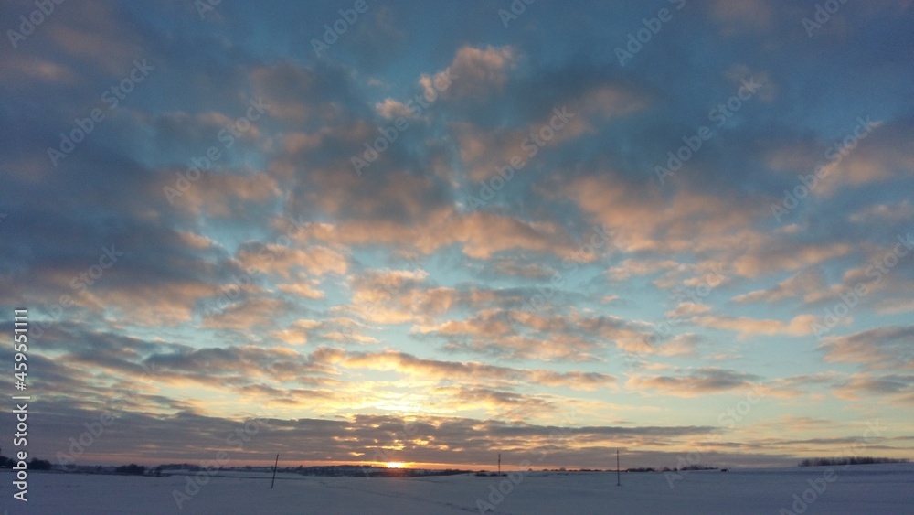Winter landscape with a beautiful sunset, beautiful clouds