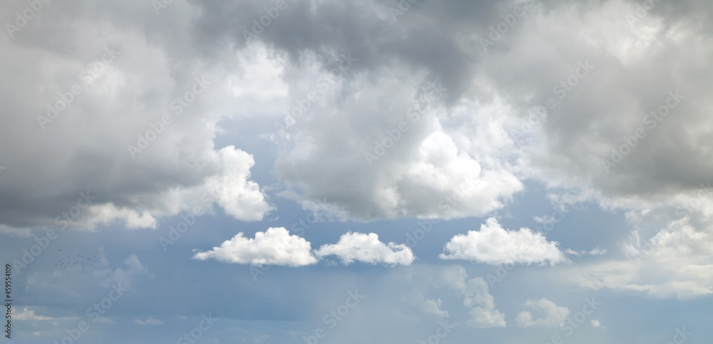 White clouds against a stormy sky White clouds against a stormy sky