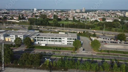 Aerial drone shot showing the busy E19 highway on the ringroad in Antwerp and the aquafin water treatment plant photo