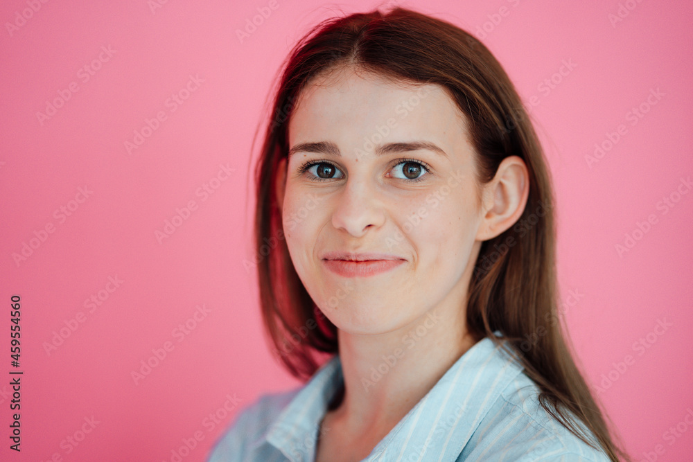 Smiling beautiful woman against pink background Smiling beautiful woman against pink background