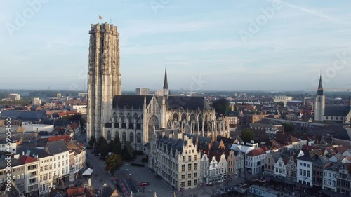 
Aerial drone shot of Mechelen Saint Rumbold's Cathedral Sint Rombouts toren in a lovely morning light while birds are flying around