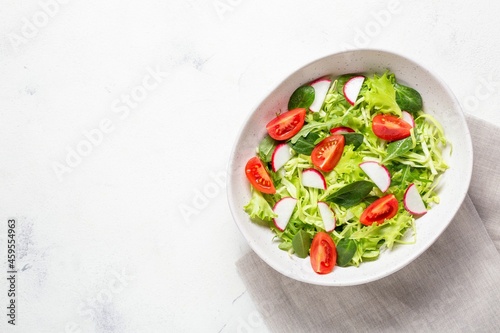 Vegetarian fresh salad. Healthy food, diet lunch. Top view on a white background.