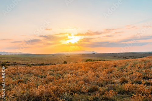 Scenic mountain landscape at sunset. Colorful travel background. © KseniaJoyg