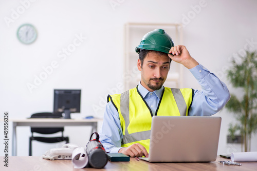 Young male architect working in the office
