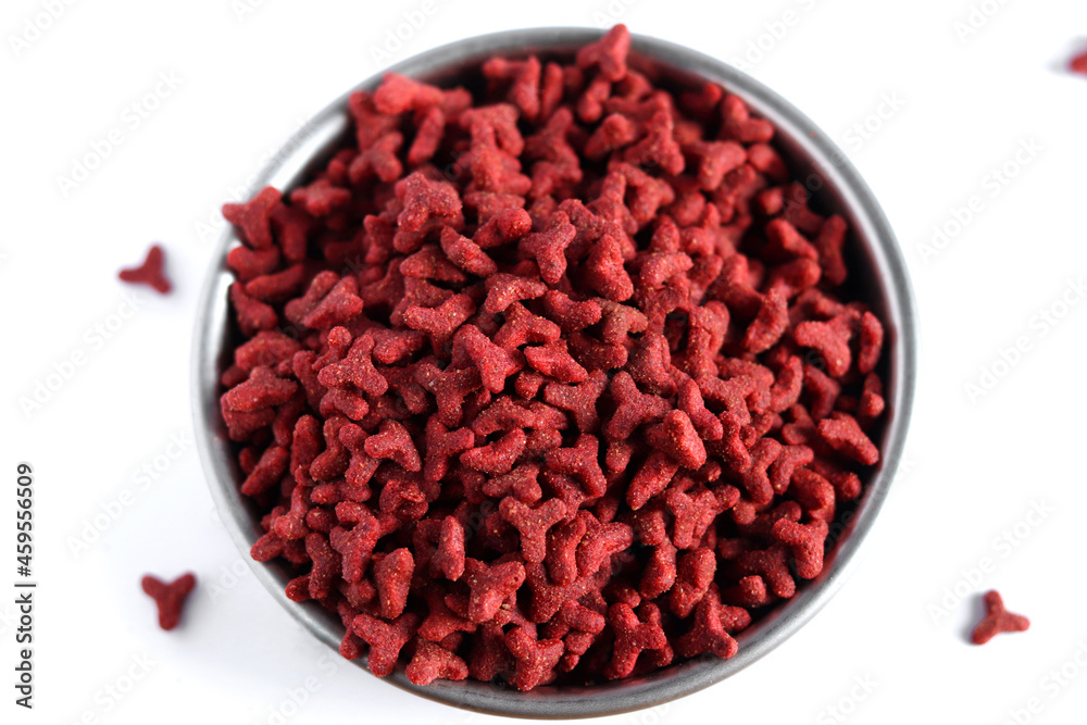 Dry red cat food in metal bowl isolated on white background Dry red cat food in metal bowl isolated on white background