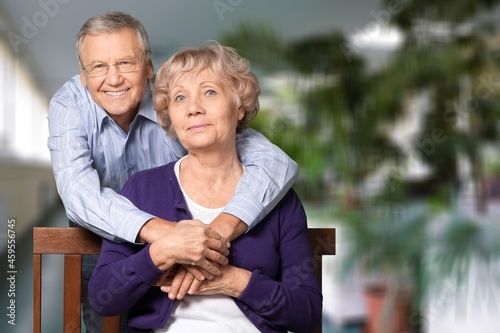 Happy older mature classy couple hugging, thinking of good future. © BillionPhotos.com