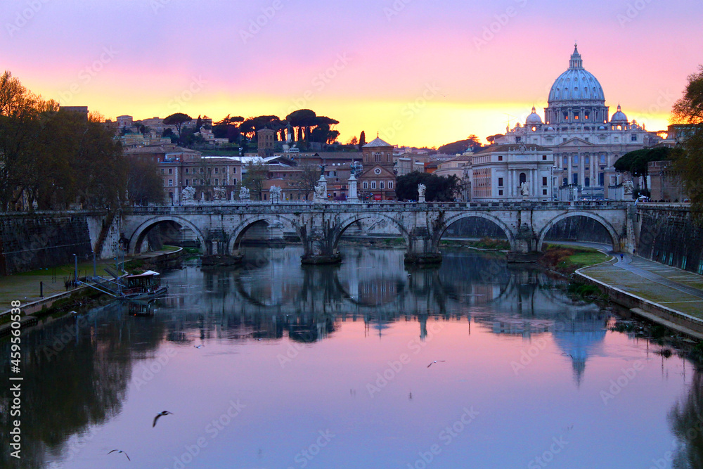 The colors of the sunset on the river with Vatican City on the back