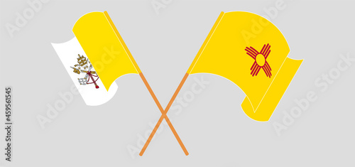 Crossed and waving flags of Vatican and the State of New Mexico