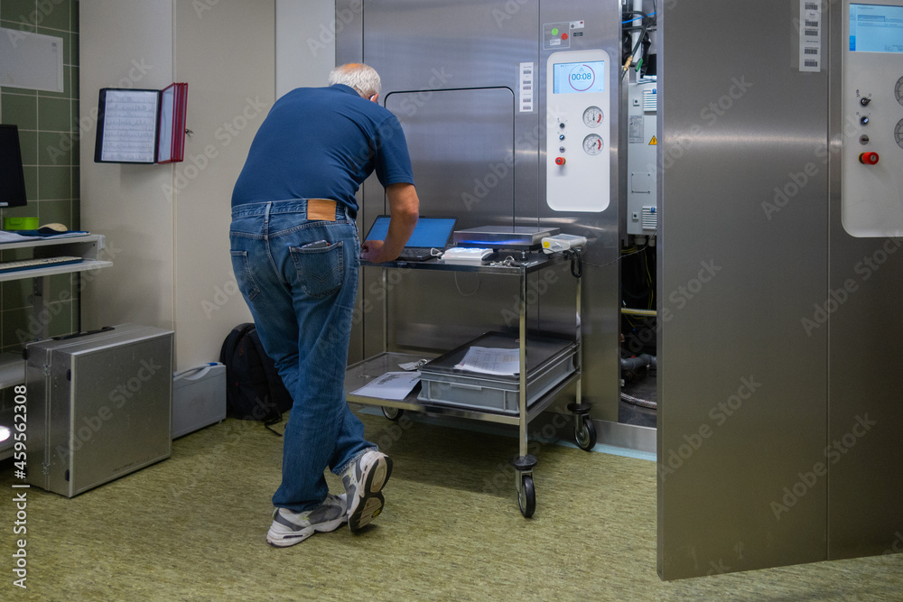  man performs validation on a sterilizer