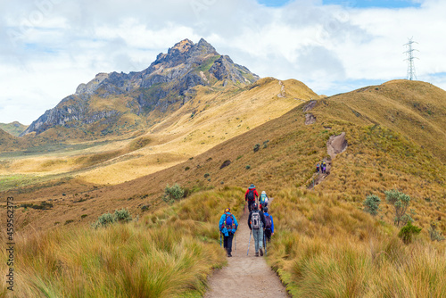Small group of people with backpack hiking the Rucu Pichincha hike to the 4696m high Andes peak  Pichincha volcano  Quito  Ecuador.