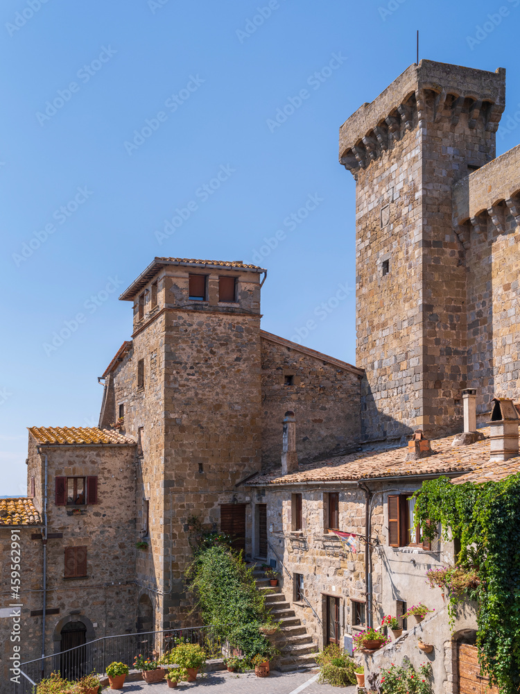 towers of old palace under blue sky in city Bolsena in Italy