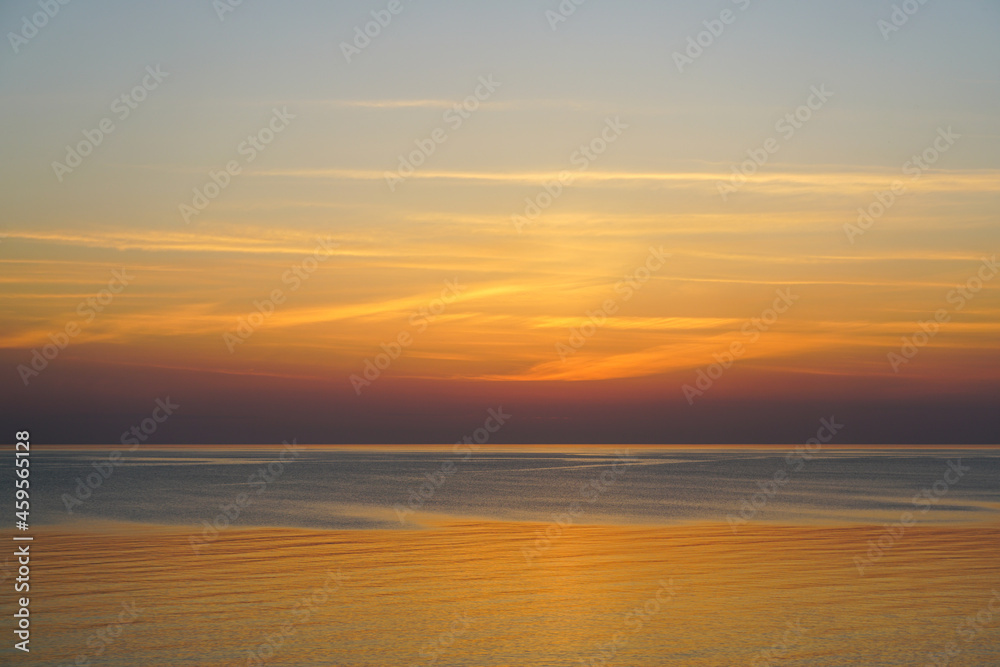 Obraz premium colorful view of the baltic sea and the sky at dusk after sunset