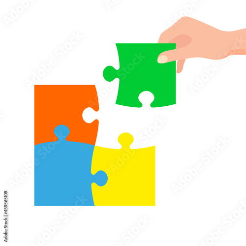 Hand connecting jigsaw puzzle. Business concept. Symbol of teamwork, cooperation, partnership