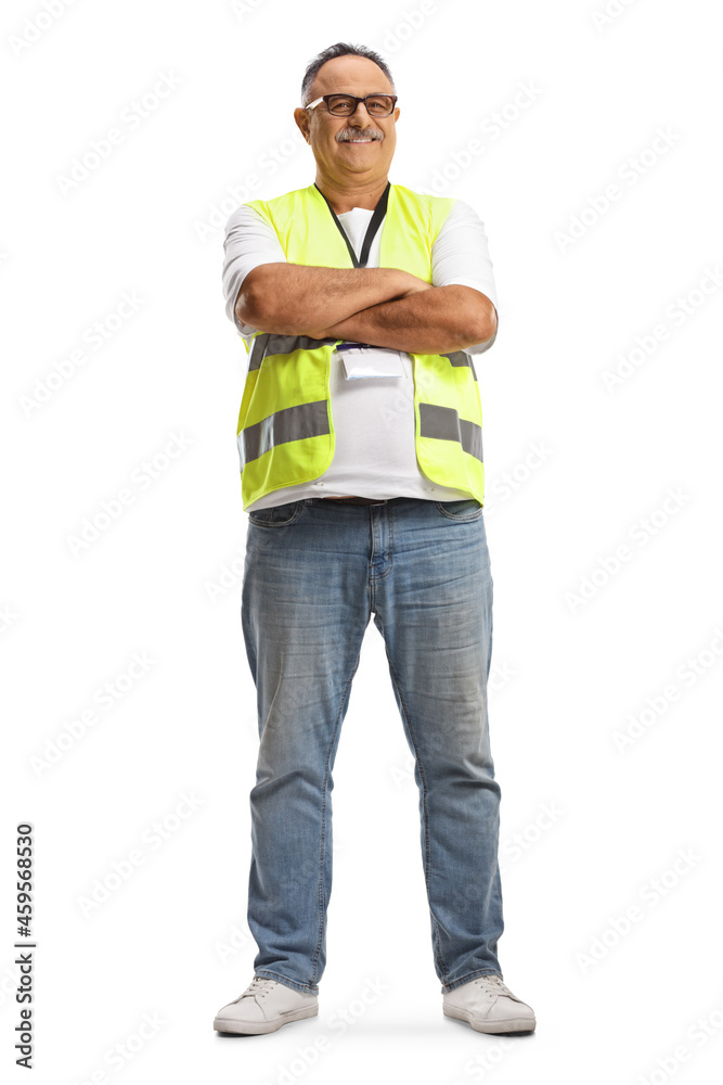 Full length portrait of a smiling mature man wearing a reflective vest and posing with crossed arms Full length portrait of a smiling mature man wearing a reflective vest and posing with crossed arms