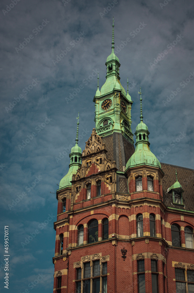 Obraz premium Typical red brick building with green roofs in Hamburg´s famous and historical Speicherstadt.