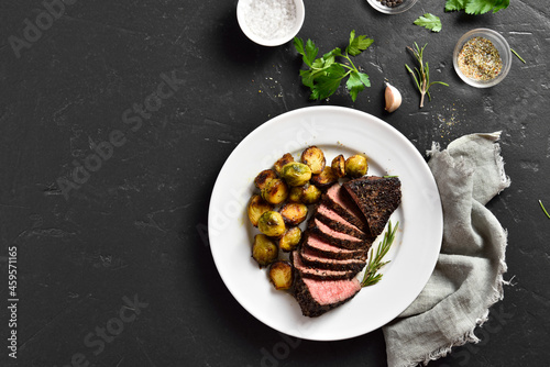 Grilled beef steak with brussels sprouts photo