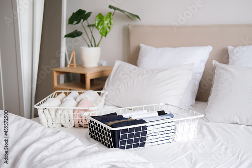 Things in mesh storage containers. Vertical storage of clothing. Sorting clothes in baskets room cleaning concept.