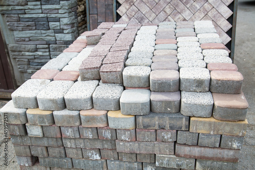 Murais de parede A stack of oval and rectangular paving stones of light lilac, beige color