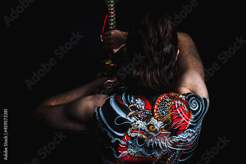 yakuza with dragon tattoo on back