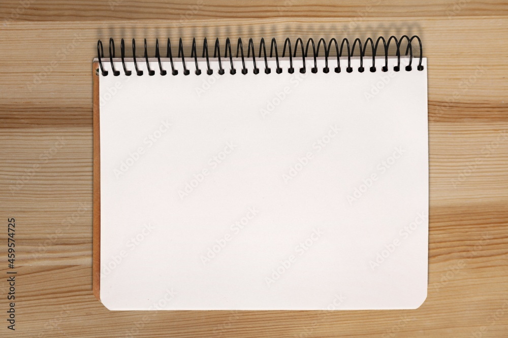 One page of the blank monthly calendar on the desk