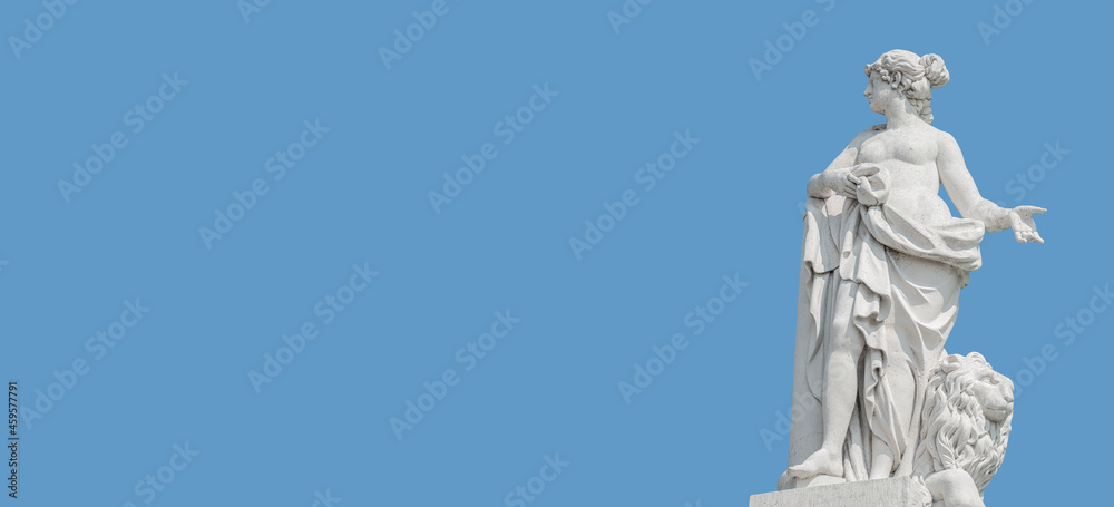 Fototapeta premium Banner with old statue of sensual renaissance era woman with a big lion at blue sky solid background with copy space, Potsdam, Germany. Concept of historical architecture heritage.