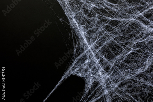 Dark halloween background with fake spider webs