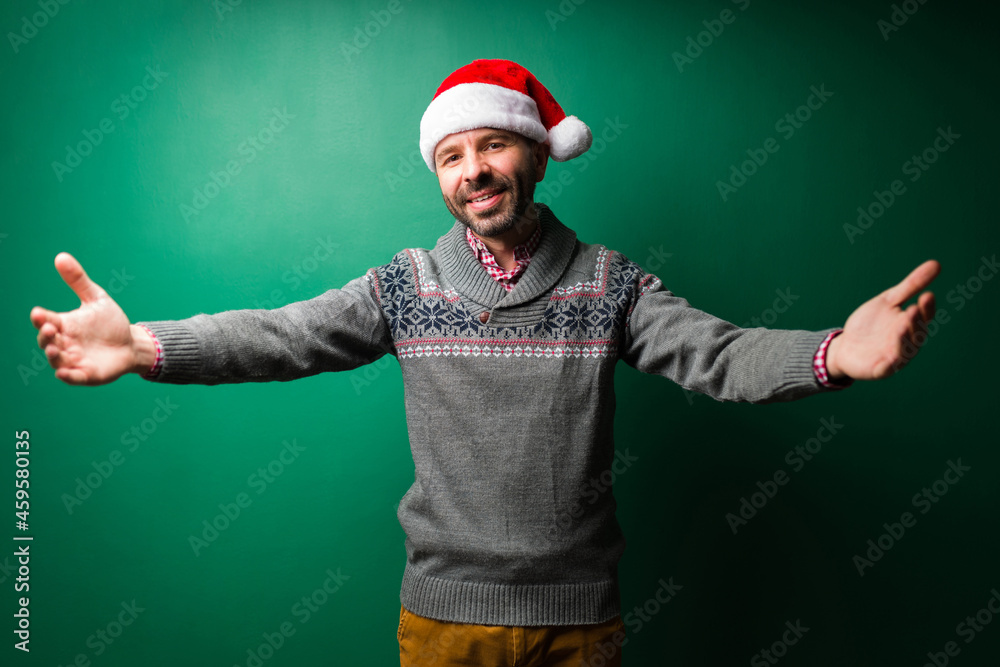 Handsome man saying Merry Christmas Handsome man saying Merry Christmas