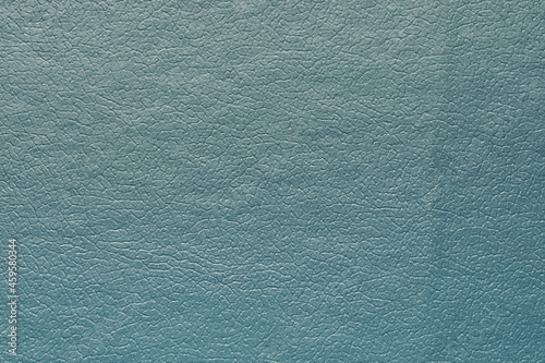 Synthetic blue leather for background. Close-up detail macro photography view of texture decoration material, pattern background design for poster, brochure, cover book and catalog.