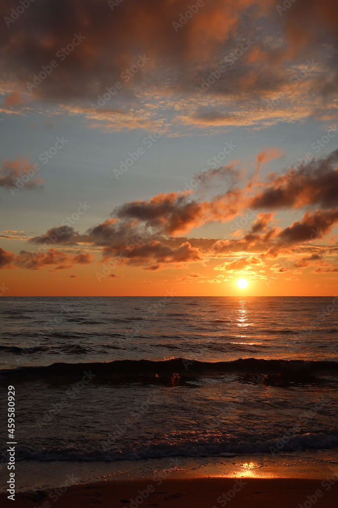 Scenic sunset over the sea. Calm Baltic sea. Poland seaside,  Dabki village and beach. Seascape