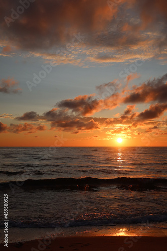 Scenic sunset over the sea. Calm Baltic sea. Poland seaside,  Dabki village and beach. Seascape photo