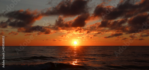 Scenic sunset over the sea. Calm Baltic sea. Poland seaside,  Dabki village and beach. Seascape photo