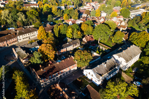 Aerial view of old town in city Kuldiga and red roof tiles, Latvia. Sunny autumn morning.