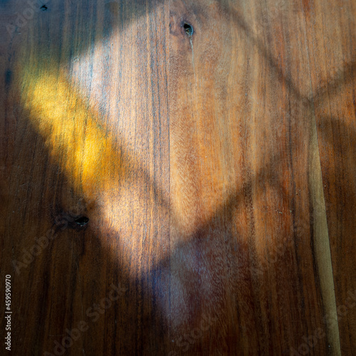 Wooden surface with sunrays in the mornin photo