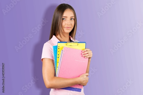 Photo of charming attractive young woman hold textbooks