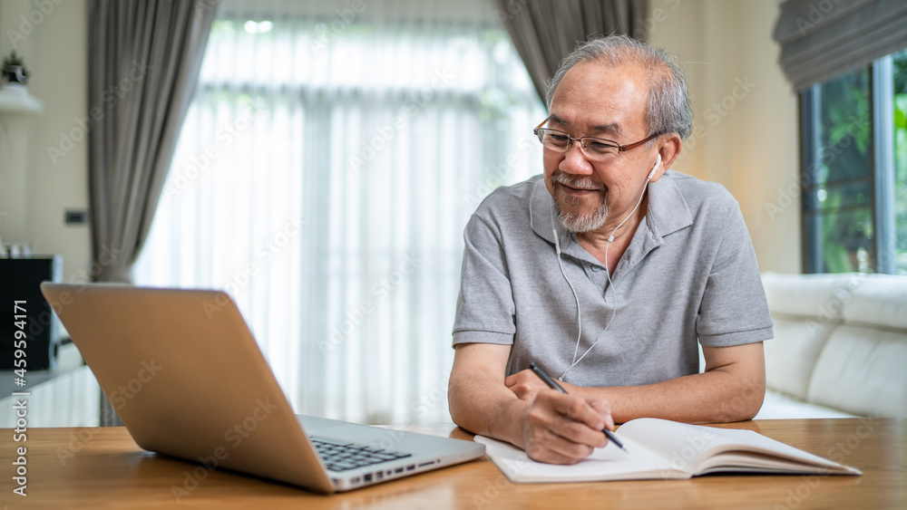 Home office of Asian Senior elderly business man working online home.  - obrazy, fototapety, plakaty 