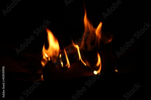 fire in the fireplace with black background hd background with space for writing text
