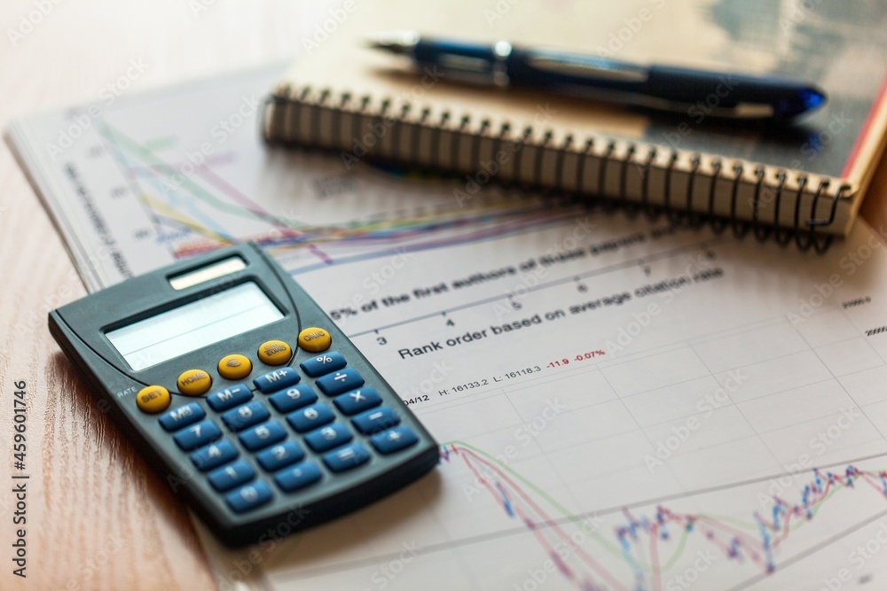 Calculator, Pen and Business Charts Calculator, Pen and Business Charts