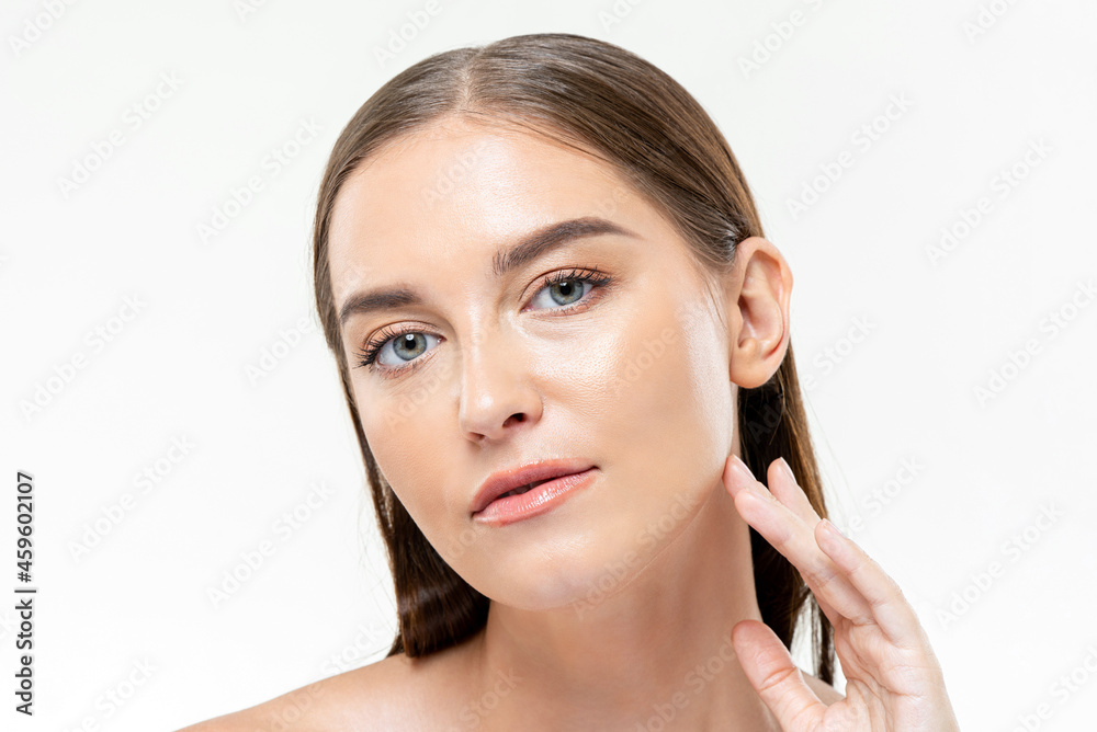 Hydrating healthy clear skin woman touching her face in isolated white studio background for beauty and skincare concepts Hydrating healthy clear skin woman touching her face in isolated white studio background for beauty and skincare concepts