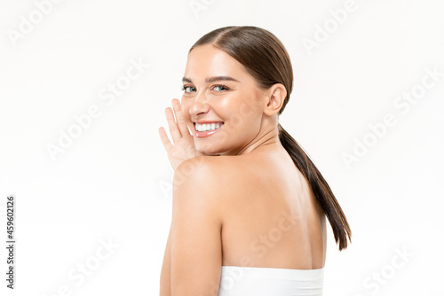 Beauty shot of smiling pretty Caucasian woman with clear and healhy skin in isolated white studio background photo