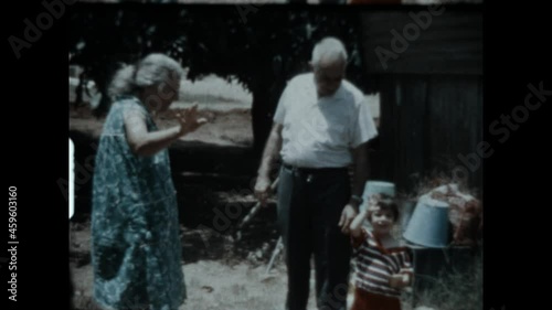 Grandparents Wave Goodbye 1974 - Grandparents and grandson wave goodbye.  photo