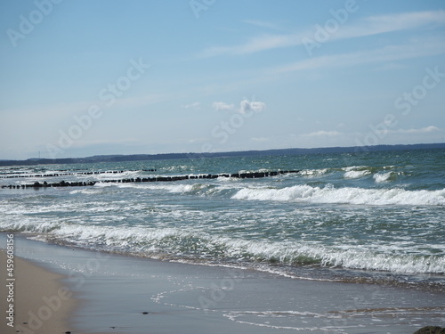 Wooden brakwater in a stormy sea.  photo