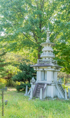 Pagoda under shade tree at Buddhist temple