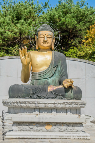 Large bronze seated Buddha at Buddhist temple.