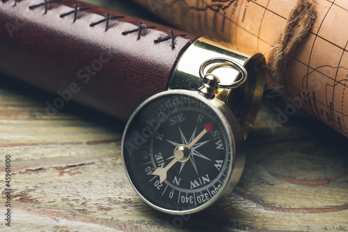 Old spyglass and compass wi...