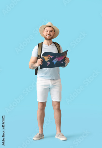 Male tourist with map on co...