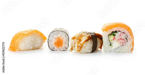Different sushi and rolls on white background