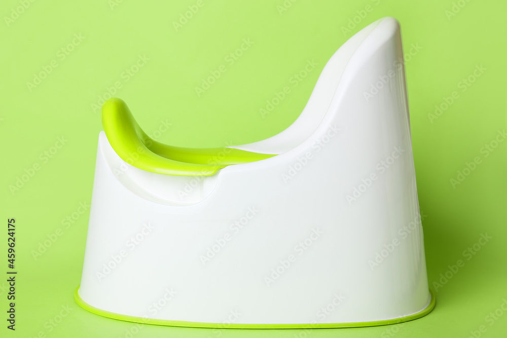Potty on color background. Toilet training concept Potty on color background. Toilet training concept