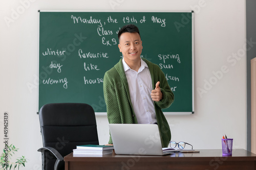 Asian teacher conducting En...