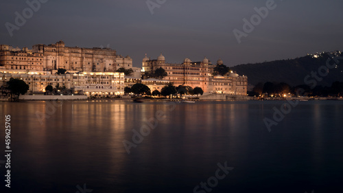 Long Exposure photograph of City Palace near lake Pichola during night
